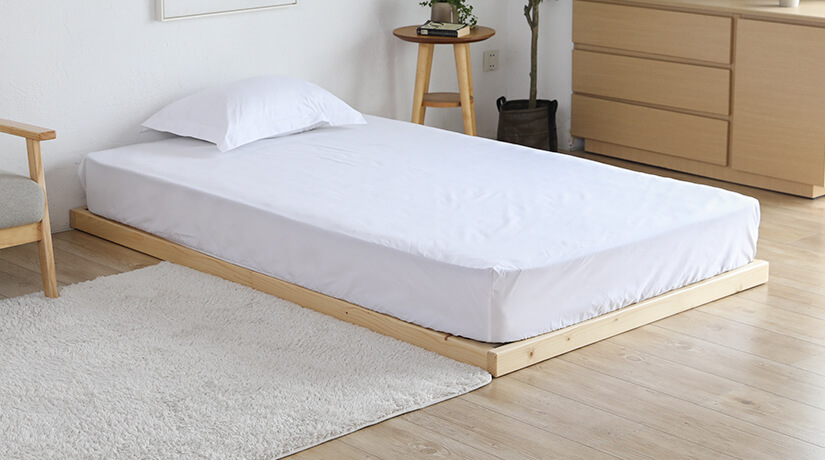 Cuenca bed frame used without its legs as a low bed